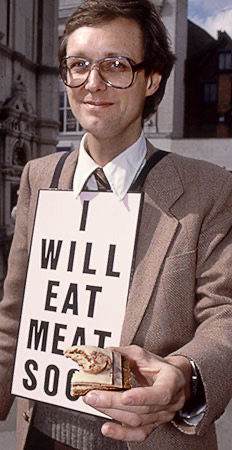 PICTURE: color photo of Gibson showing photographers remaining half of the meat hors d'oeuvre.