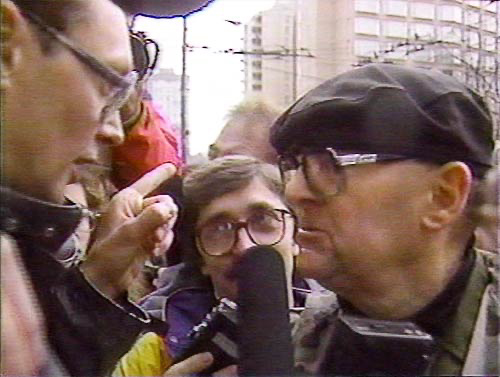 PICTURE: black and white photo of Rick Gibson talking to protester.